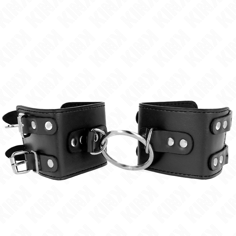 KINK - SUJECIONES DE MUÑECA FIJAS CON ANILLA Y Tachuelas AJUSTABLES NEGRAS 17-22 CM X 6.5 CM