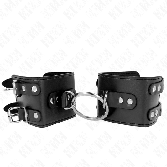 KINK - SUJECIONES DE MUÑECA FIJAS CON ANILLA Y Tachuelas AJUSTABLES NEGRAS 17-22 CM X 6.5 CM